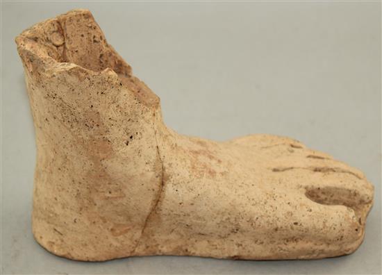 An Etruscan terracotta votive left foot, c.3rd century BC, 21cm, repaired